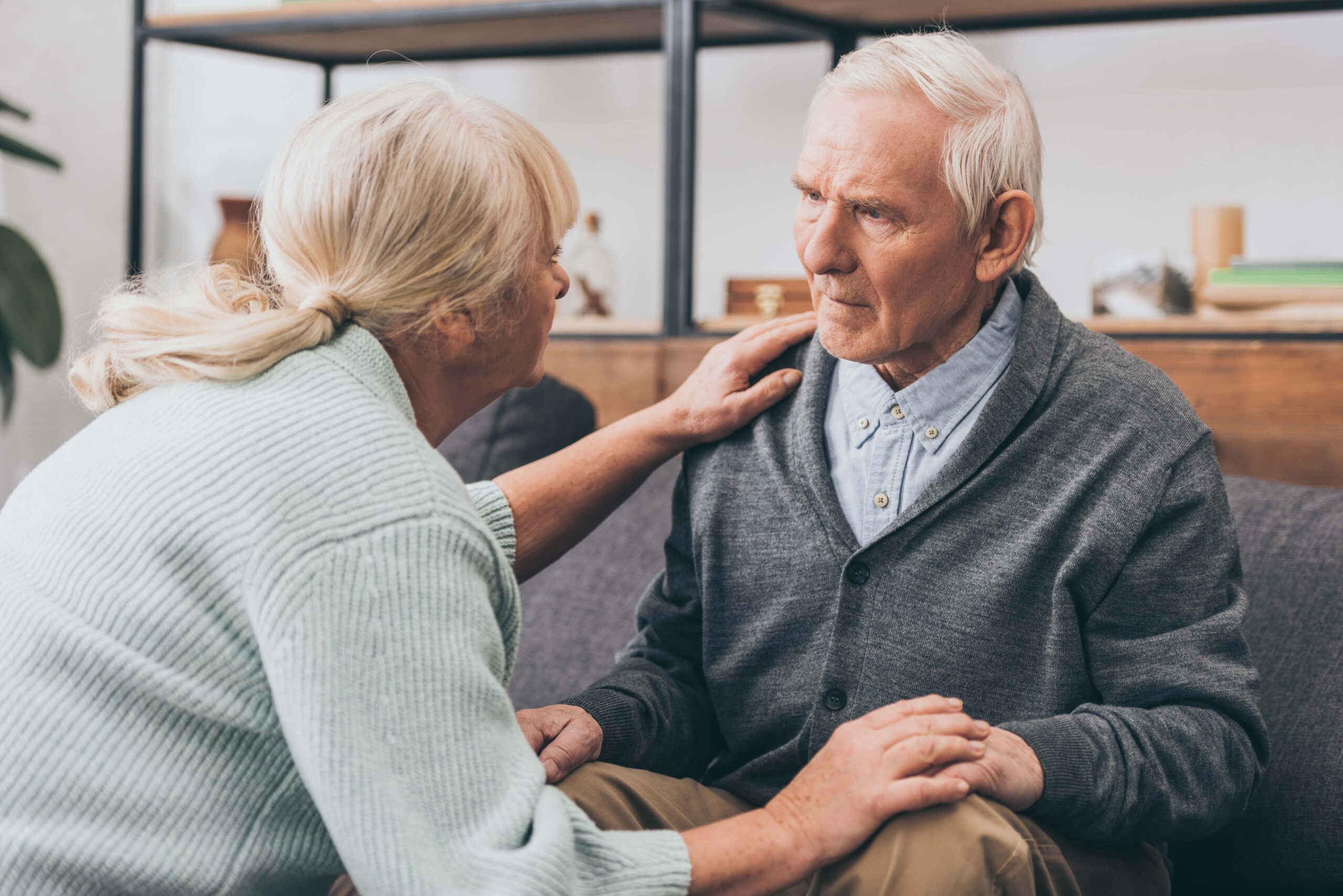 a woman speaking with a man with dementia.