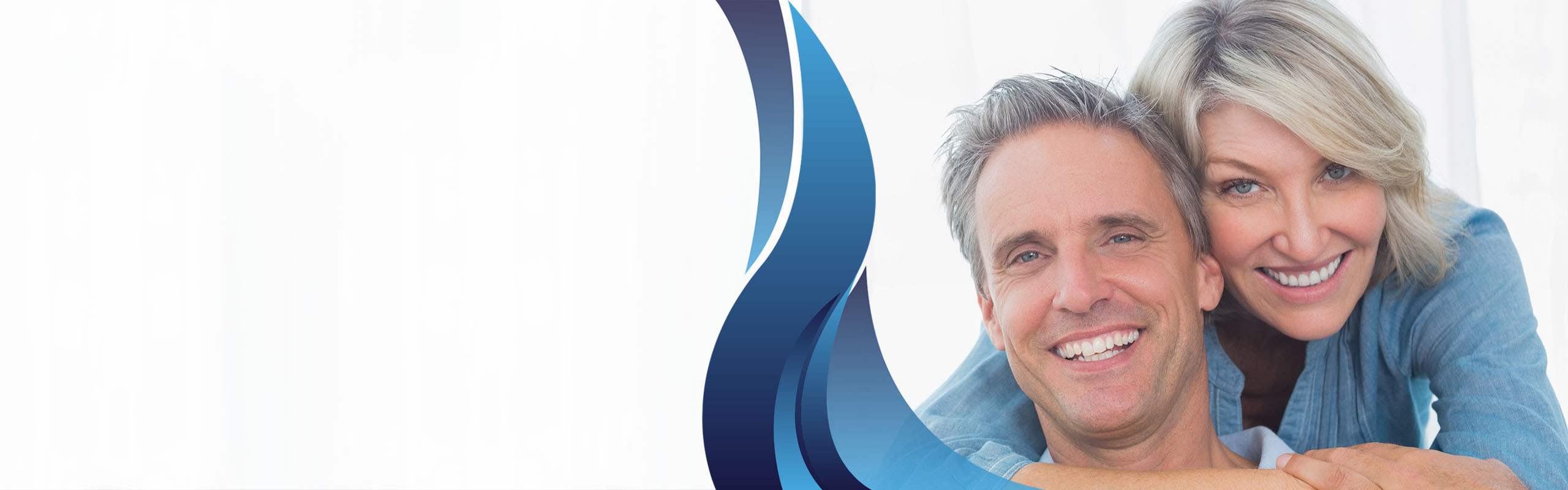 A wife and husband smiling.